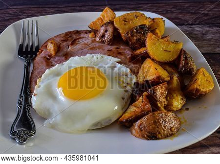 Ham Top With  A Fried Egg And Home Fries,