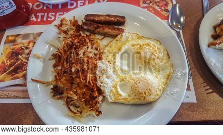 Two Eggs With Sausages And Hash Browns