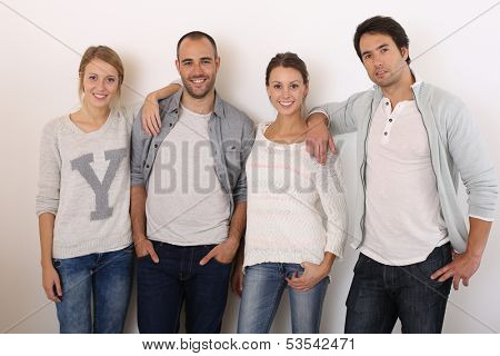 Group of smiling friends hanging around