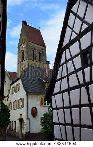 Street with half-timbered medieval houses in Eguisheim village along the famous wine route in Alsace