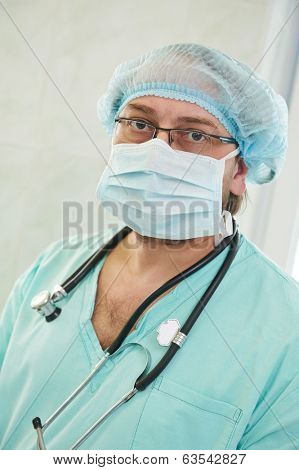 anesthesiologist doctor in uniform preparing narcosis anesthesia during heart transplantation operation at cardiac surgery clinic