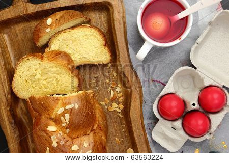 Easter sweet brioche, red eggs and liquid dye