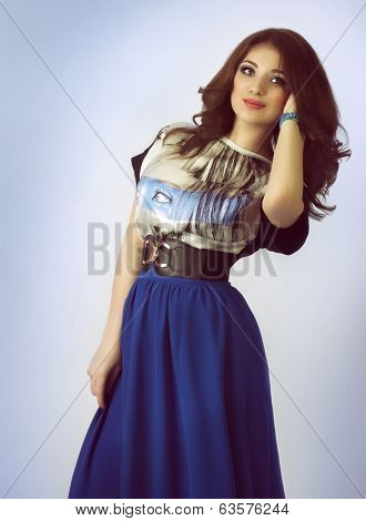 Portrait of beautiful young woman with makeup and precious decorations