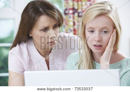 Mother Comforting Daughter Victimized By Online Bullying