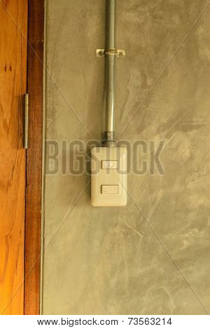 White Plastic Switch Panel Is On Loft Style Wall