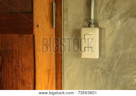 White Plastic Switch Panel Is On Loft Style Wall