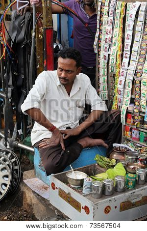 KOLKATA, INDIA - FEBRUARY 08: Streets of Kolkata. Making Paan in Kolkata. Areca nut and spices wrapped in a betel leaf which is chewed and then spat out, February 08, 2014.