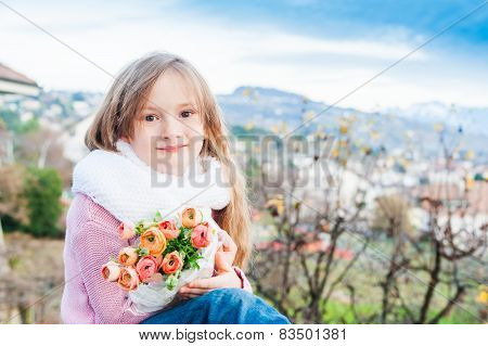 Outdoor portrait of a cute little girl
