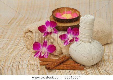 Spa Massage Setting With Herb, Towel, Compress Balls And Aroma Candle