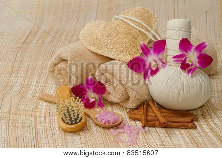 Spa Massage Setting With Herb, Towel, Compress Balls And Salt Scrub