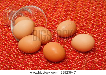 Eggs On The Red Fabric Background