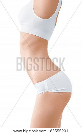 Woman with perfect slim body in white underwear isolated on white.