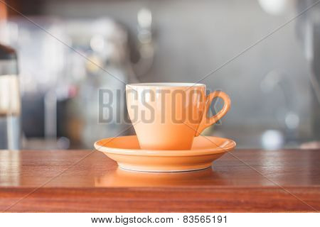 Orange Coffee Cup In Coffee Shop