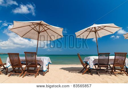 Table Set And Umbrella On The Beach