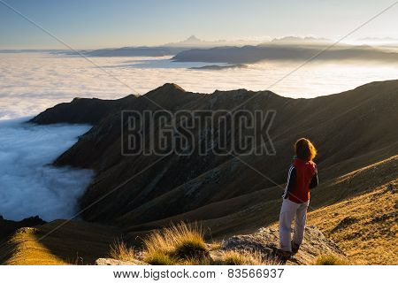 Woman Resting On The Mountain Top