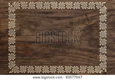 celtic border knotwork ornament design wooden background