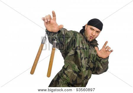Young man in soldier uniform holding nunchaks isolated on white