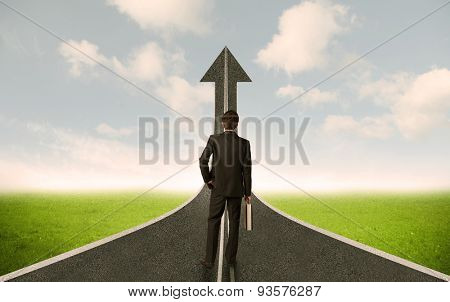 Businessman lokking at 3d road upgoing arrow concept