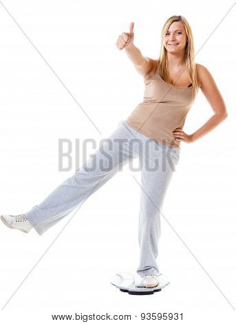 Girl On Scales Celebrating Weightloss