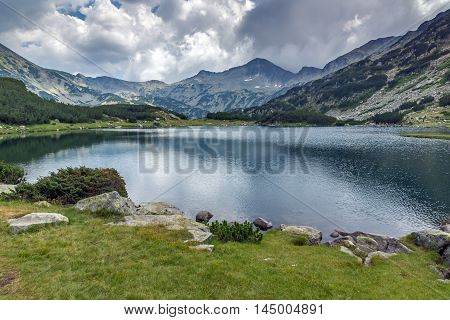 Panoramic view of Banderishki chukar peak and Reflection in Muratovo lake, Pirin Mountain, Bulgaria