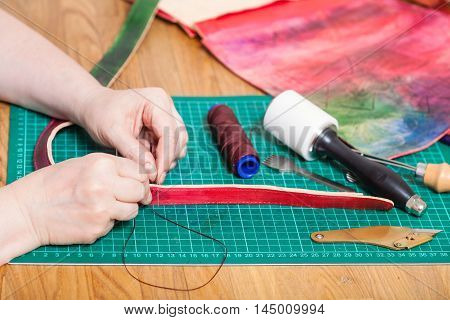 Craftsman Makes Leather Belt For New Embossed Bag