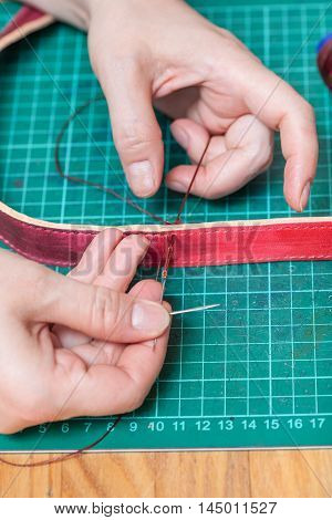 Craftsman Sews New Leather Belt