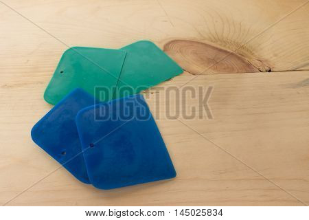 plastic putty spattles on wood in thai
