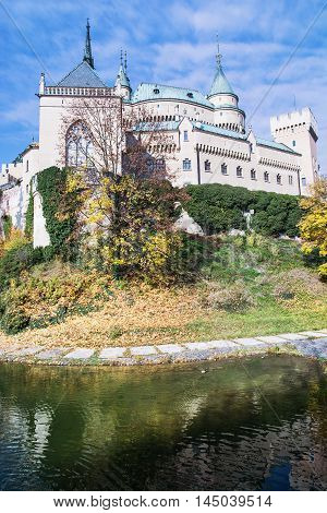 Bojnice castle with water reservoir in Slovak republic. Cultural heritage. Seasonal scene. Autumn trees. Beautiful place. Vibrant colors.