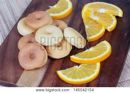 Milk donut with sliced orange home made. Selective focus
