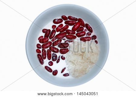 Red bean with Thai sticky rice in coconut creamon white background.