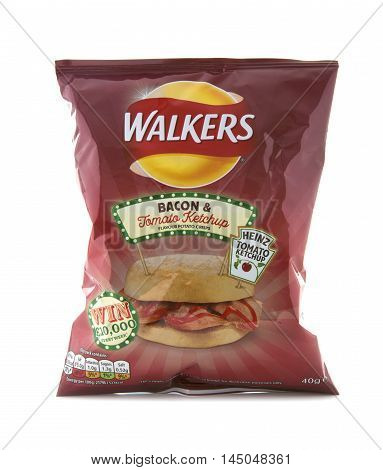 SWINDON UK - AUGUST 27 2016: A Bag of Walkers Bacon and Tomato Ketchup Flavour crisps isolated on a white background. Walkers is a British snack food manufacturer
