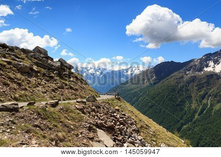 Gavia pass road with panorama view alpine mountains Adamello Alps Italy