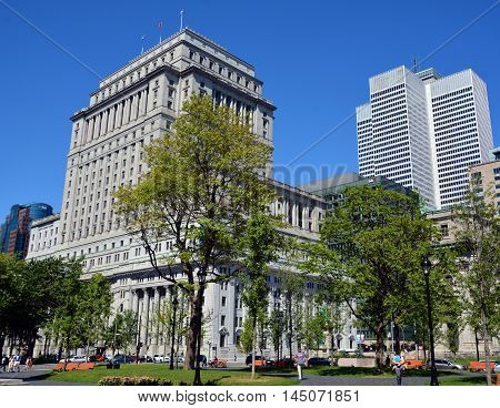 MONTREAL QUEBEC CANADA AUGUST 30 2016: The Sun Life Building is an historic office building at 1155 Metcalfe Street. Place ville Marie in background.