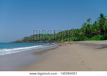 Sea view from hidden beach with palms near Agonda beach Goa state India