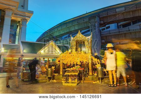 The Erawan Shrine at Ratchaprasong Intersection at night time
