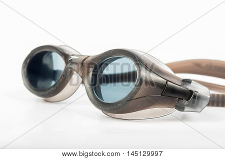 Gray professional swimming goggles on white background