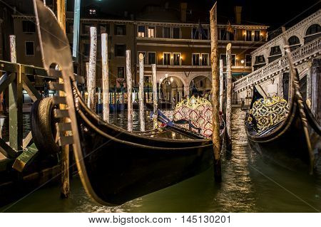 Canal with boats and gondola in romantic Venice
