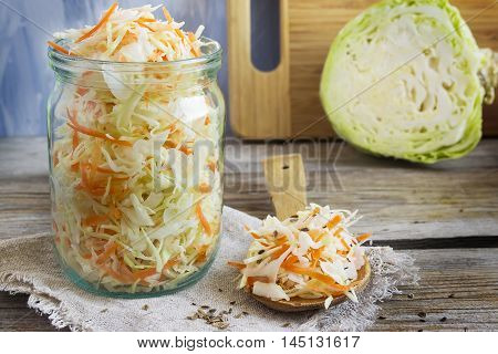 Pickled cabbage with carrots and red hot peppers selective focuc