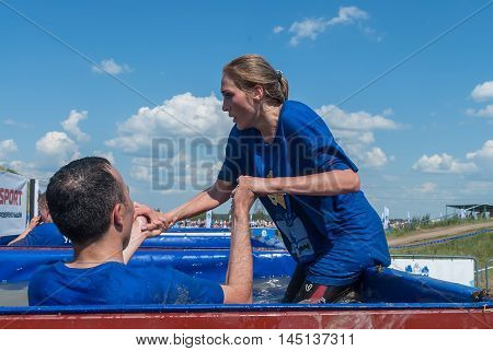 Tyumen, Russia - July 9, 2016: Steel Character extrim race on Voronino Hill. Ice bathtubs stage