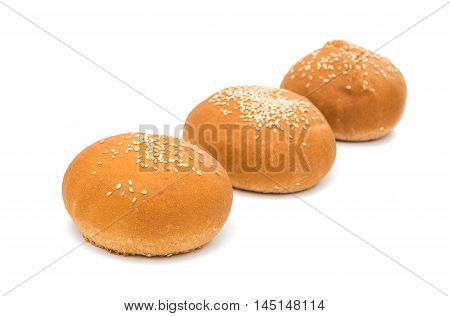 foodstuffs sesame brown buns on white background