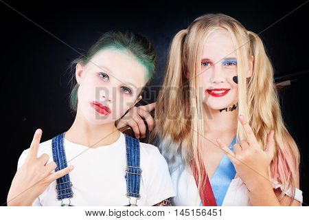 Young Teenager Girls in Carnival Costume on dark background