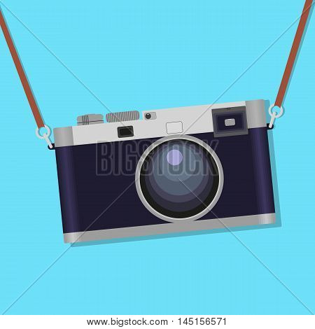 Old photographic camera over blue background. flat style