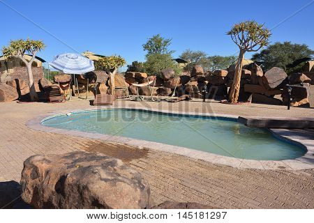 KEETMANSHOOP NAMIBIA - JAN 25 2016: Swimming pool in Quivertree Forest Rest Camp where visitors can explore the ancient and famous Quivertree Forest