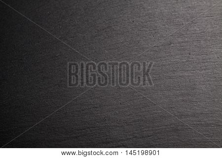 Black slate background. Deep black stone texture.