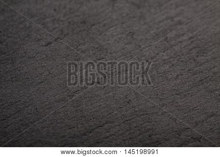 Black slate background. Deep black stone texture.