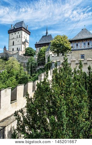Karlstejn is a large gothic castle founded 1348 by Charles IV in Czech republic. Ancient architecture. Travel destination. Vertical composition.