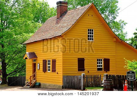 Old Salem North Carolina - April 21 2016: The 1771 wood frame Miksch House with extended back addition and central chimney *