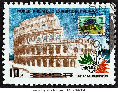 NORTH KOREA - CIRCA 1985: A stamp printed in North Korea from the "Italia 85 International Stamp Exhibition, Rome " issue shows Colosseum, Rome, and N. Korea 1975 stamp, circa 1985.