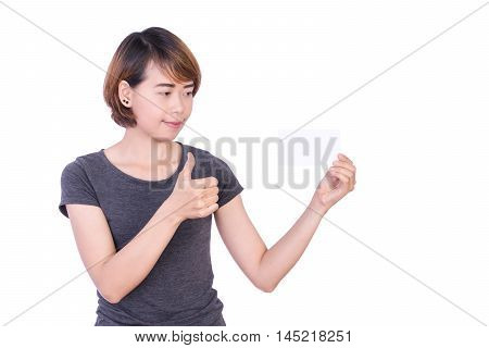 Asian People: Beautiful smart young lady showing thumbs up and look blank paper in hand on a white background