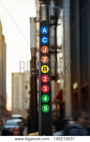 New York City metro line sign with A C J Z R 2 3 4 5 train